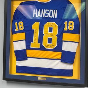Collectors Framed Hanson Brothers Jersey and Autographs